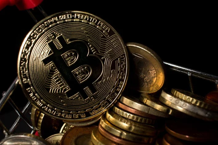 Bitcoin briefly flirts with record high in risk-on day